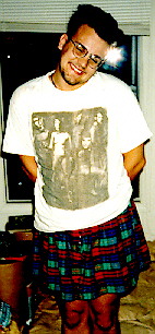 A picture of Shawn wearing a little plaid skirt and a goofy face.